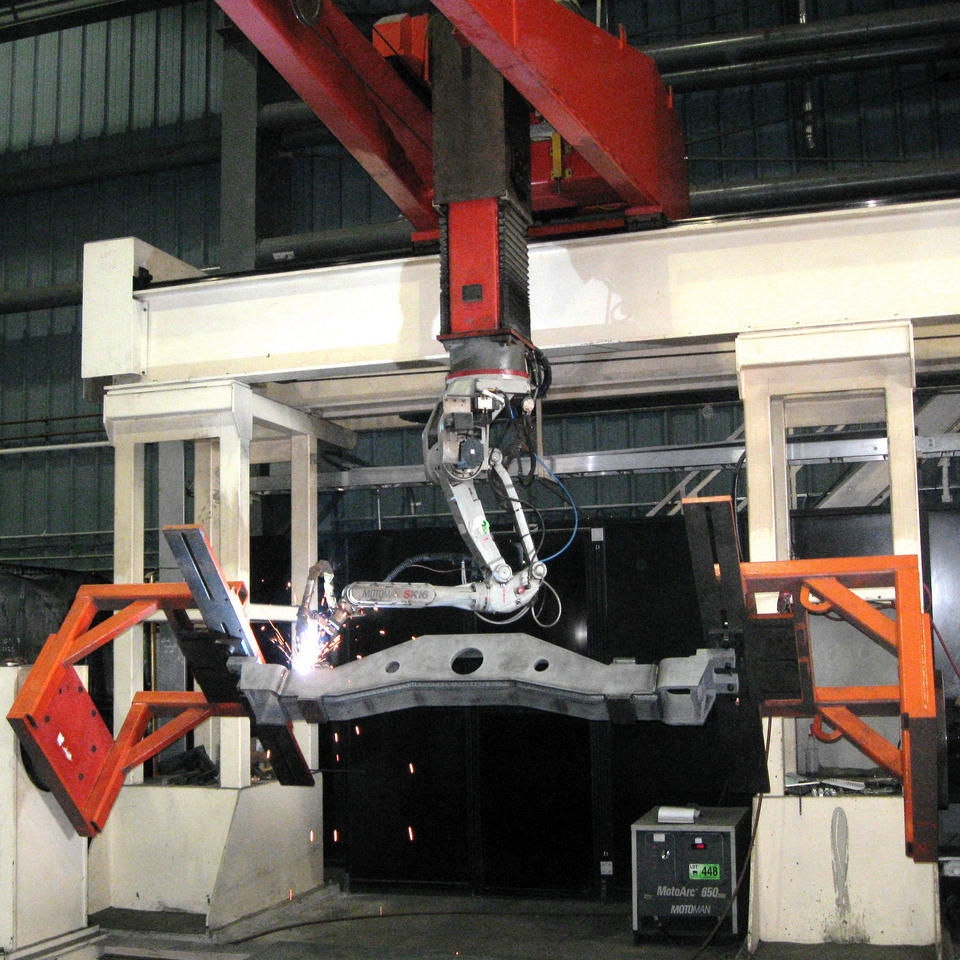 Large welding robot at ADJ Industries facility in London, Ontario, Canada.
